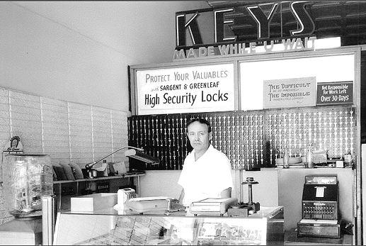 Old black and white photo of locksmith shop