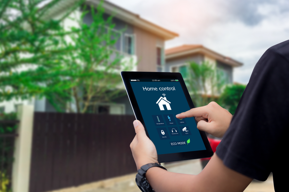 smart home control system on tablet being used by technician